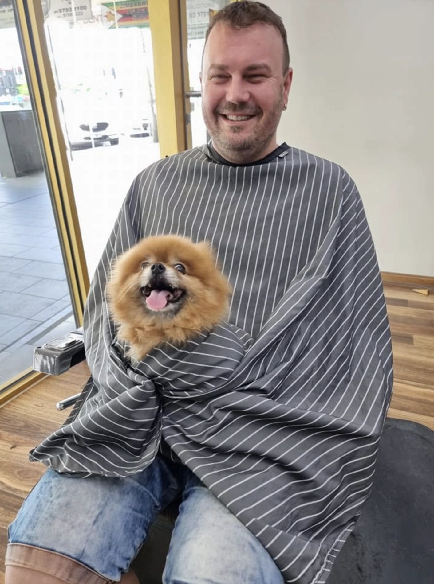 A happy client with his dog at Men In Style
